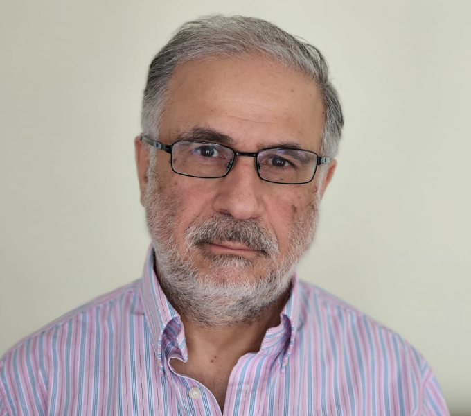 Professional headshot of Hassan Karimi, PhD